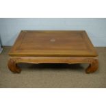 A Chinese hardwood coffee table.