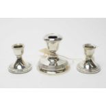 Three silver candlesticks