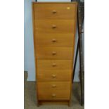 A mid-century teak chest of eight drawers.