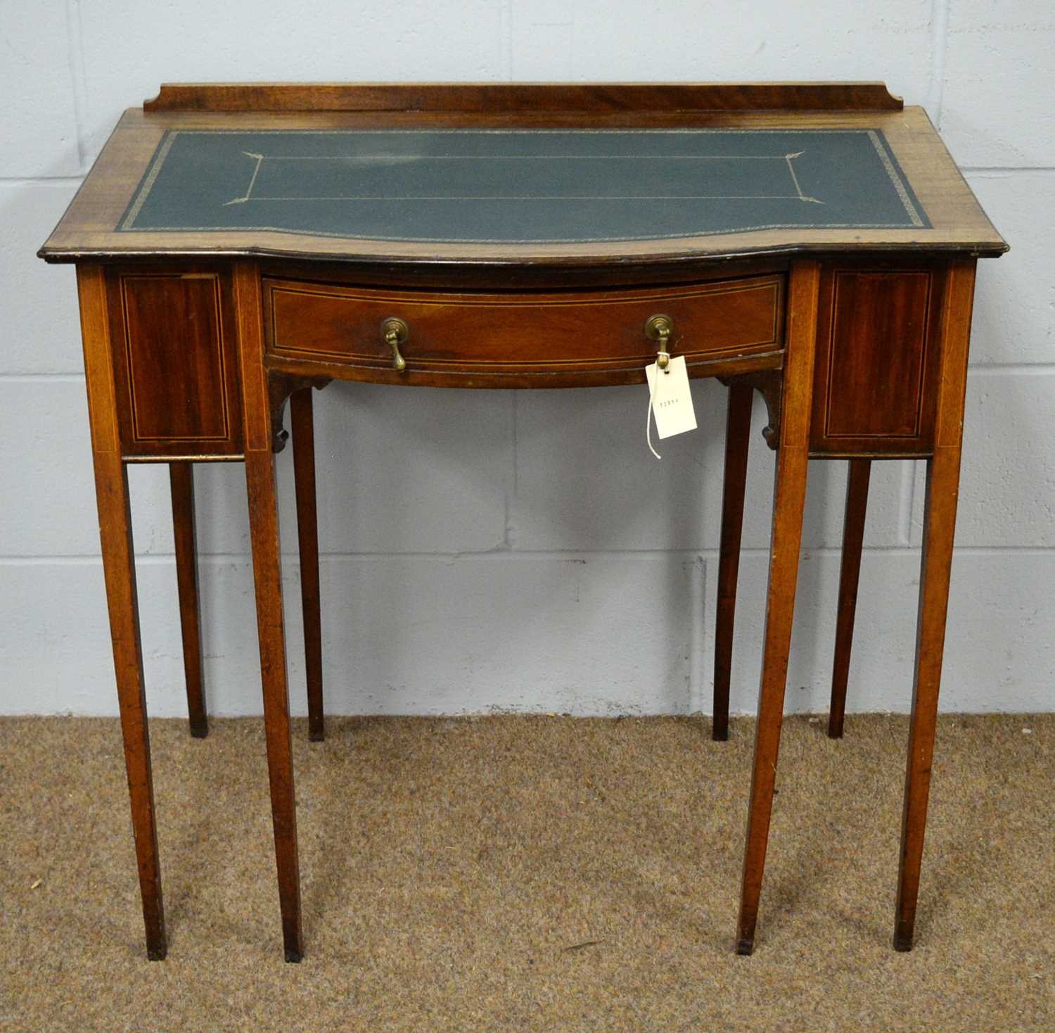 An Edwardian inlaid mahogany desk.