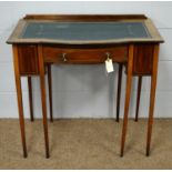 An Edwardian inlaid mahogany desk.