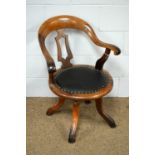An early 20th C swivel office chair.