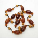 An early 20th Century single-strand necklace of amber beads