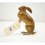 A cold painted bronze figure of a hare.