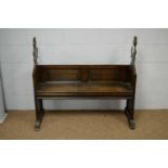 A 19th C oak ecclesiastical bench.