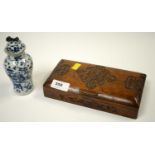 An early 20th Century carved mahogany cigarette box, together with a Chinese blue and white jar