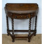 An early 20th C oak demi lune side table.