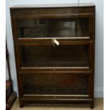 An early 20th C oak sectional bookcase by Gunn.