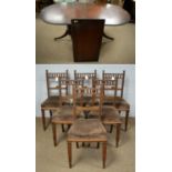 Six Edwardian oak dining chairs and a mahogany twin-pedestal dining table