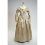 An 1840s champagne silk day dress