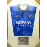 A Newcastle United away shirt signed by Peter Beardsley