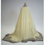 A 19th Century woven cream wool long shawl