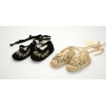 Two pairs of early Victorian florally embroidered silk baby slippers.