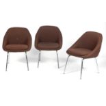 Three mid Century brown upholstered and chrome office chairs.