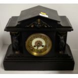 A late 19th Century French black slate mantle clock