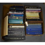 A selection of hardback books.