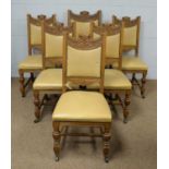 A set of six carved oak 20th C dining chairs.