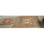 A Persian mat; and a Moroccan rug.