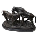 After Pierre-Jules Mêne: a bronze group of cow and bull,