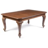 A substantial mahogany extending dining table.