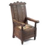 William Crawhall: an unusual mid-19th Century carved oak armchair