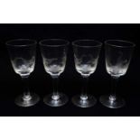 Four engraved cock fighting wine glasses