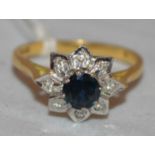 A sapphire and diamond cluster ring,