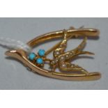 An Edwardian wishbone and swift pattern brooch