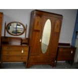 An Edwardian inlaid mahogany bedroom suite.