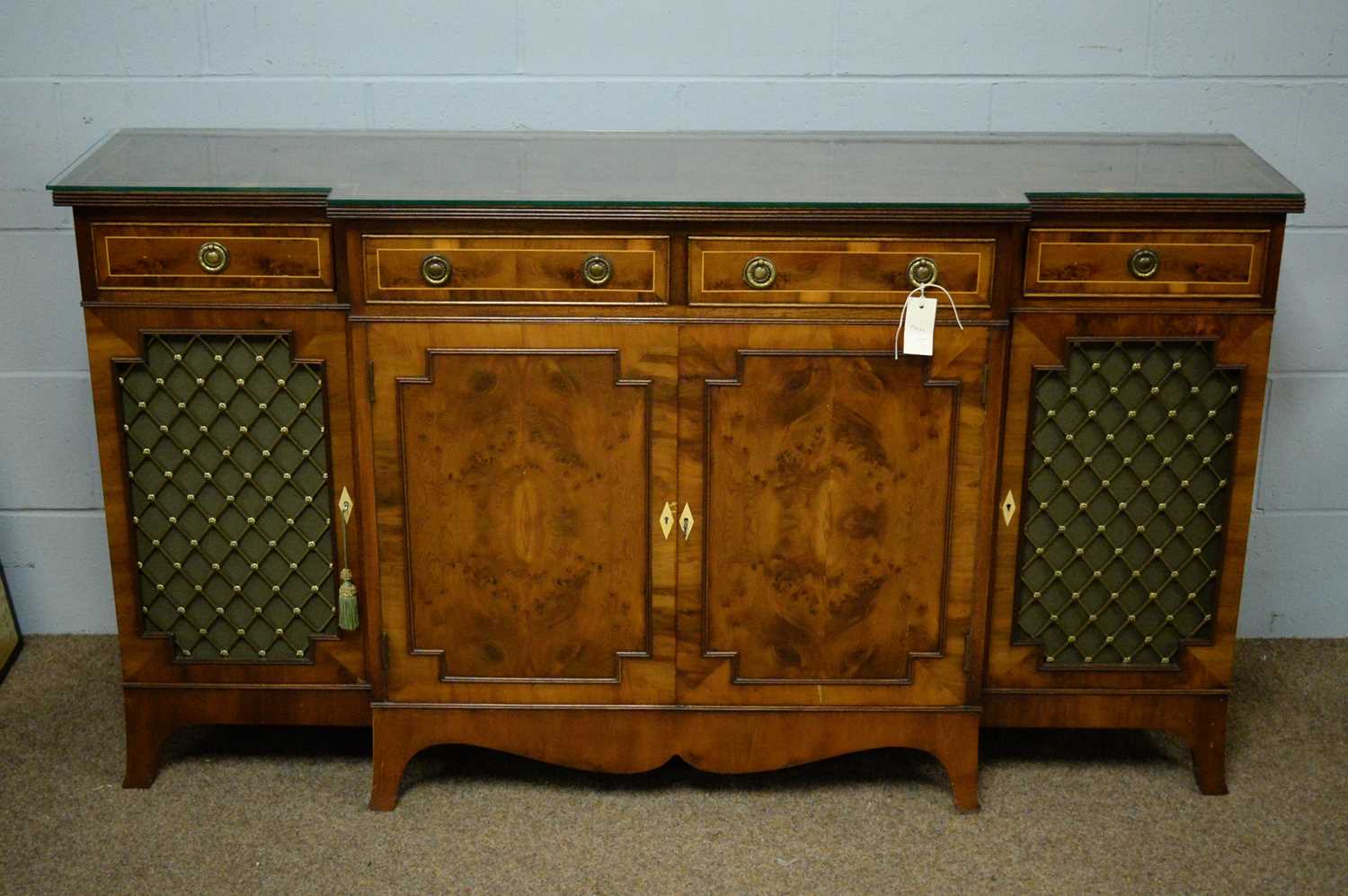 A reproduction breakfront side cabinet