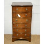 A Georgian-style mahogany and banded chest of drawers.