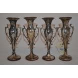 A set of four silver vases,