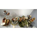 Collection of four Capodimonte figures.