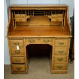 An early 20th Century oak roll-top desk