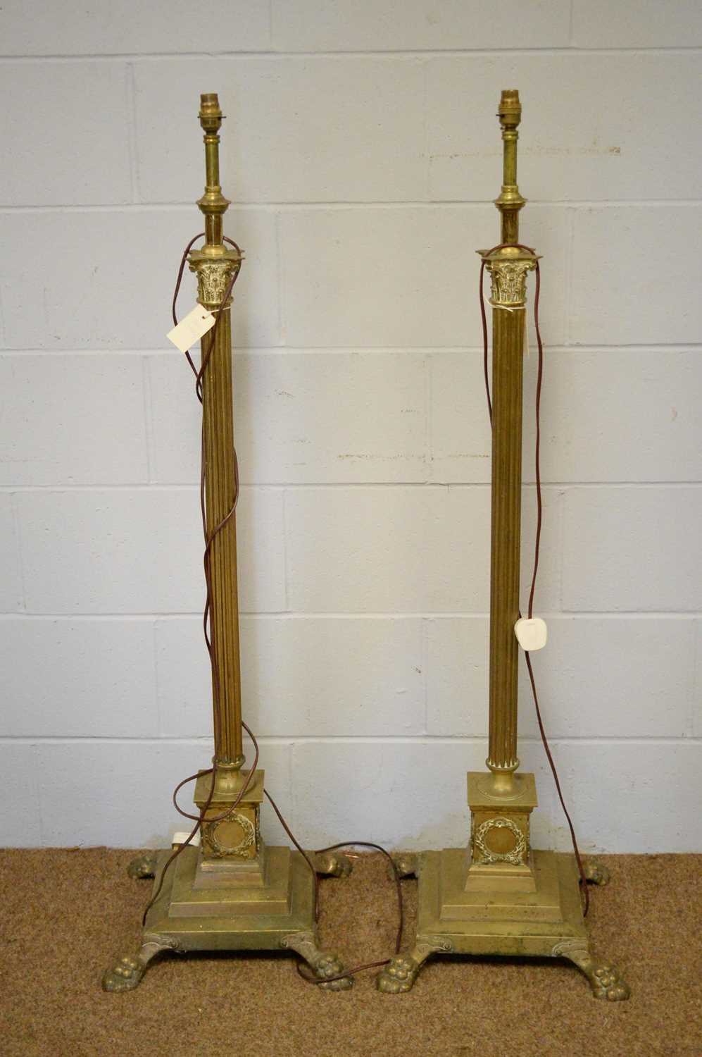 A pair of brass column-form lamp standards