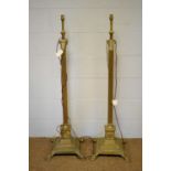 A pair of brass column-form lamp standards