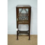 An attractive early 20th century mahogany centre display cabinet