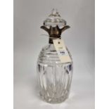 A silver mounted cut glass decanter,