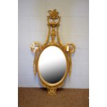 An ornate Adam style wall mirror