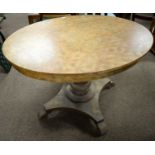 A 19th Century oval satin-birch breakfast table in the Biedermeier style