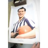 A signed photograph of Sir Bobby Robson and an Alan Shearer NUFC book.