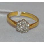 A diamond cluster ring,