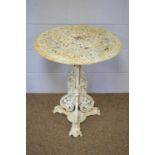 A modern cast-metal garden table,