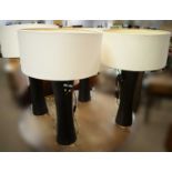 Set of four stained wood table lamps.