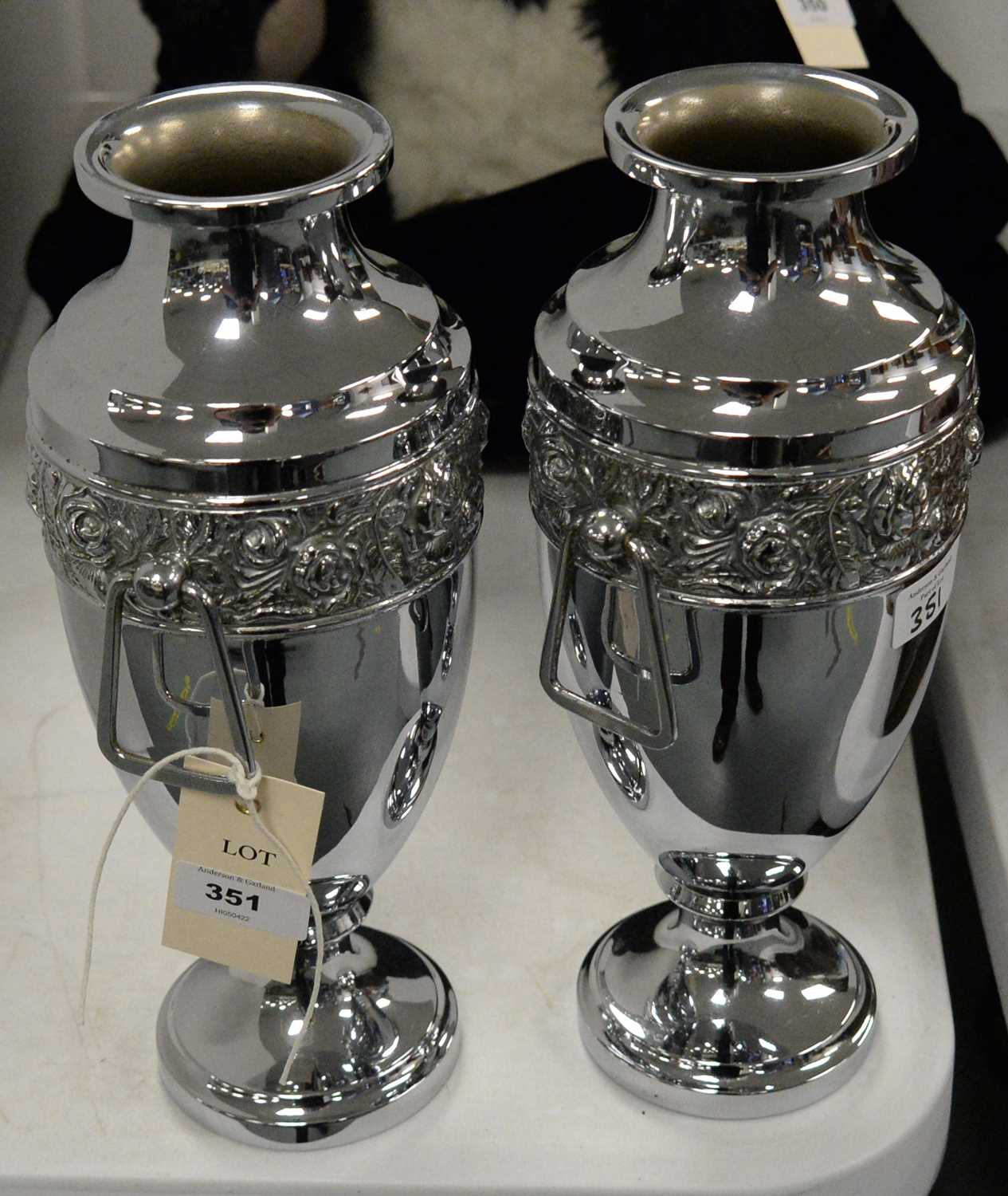 A pair of silver-plated twin-handled urn vases