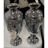 A pair of silver-plated twin-handled urn vases