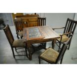 An early 20th Century oak dining suite and two stained glass doors.