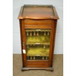 A late Victorian walnut music cabinet