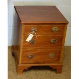 A mahogany hinged-top record/cd storage cabinet