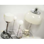 Four chrome table lamps.